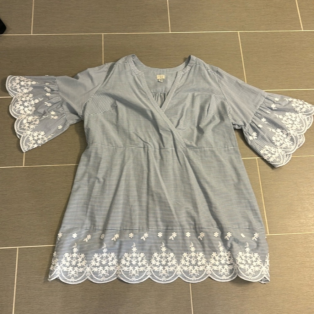 Blue dress with white flowers. Never worn but tags removed